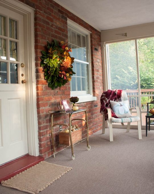 Fall Porch Decor with a Magnolia Wreath Styled for Fall